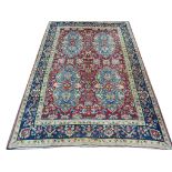 A mid 20th Century Persian Kerman carpet. 4.30m x 2.90m, condition rating B.