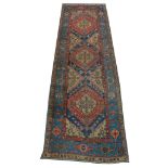 A mid 20th Century Persian Heriz runner, North West Iran, 3.10m x 1.04m, condition rating b.