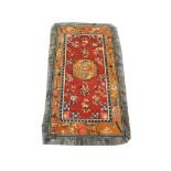 An early to mid 20th Century Tibetan rug, 1.72m x 0.90cm, condition rating A.