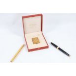 A boxed Dupont gold plated lighter, together with a gold plated Waterman fountain pen, and a