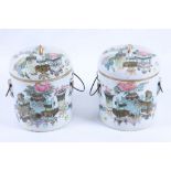 Two Chinese famille rose 'Hundred Treasures' ice buckets and covers, 17cm high x 12cm diameter.