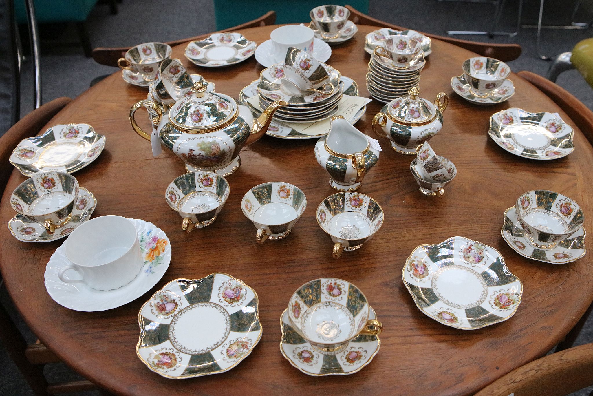A mid 20th Century German Thuringian part tea service, transfer printed with romantic scenes after