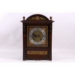 A late 19th century oak and gilt brass mounted mantel clock, the movement stamped for Winterhalder