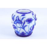 A Pekin cameo glass vase in white with blue carved overlay of waterlilies.