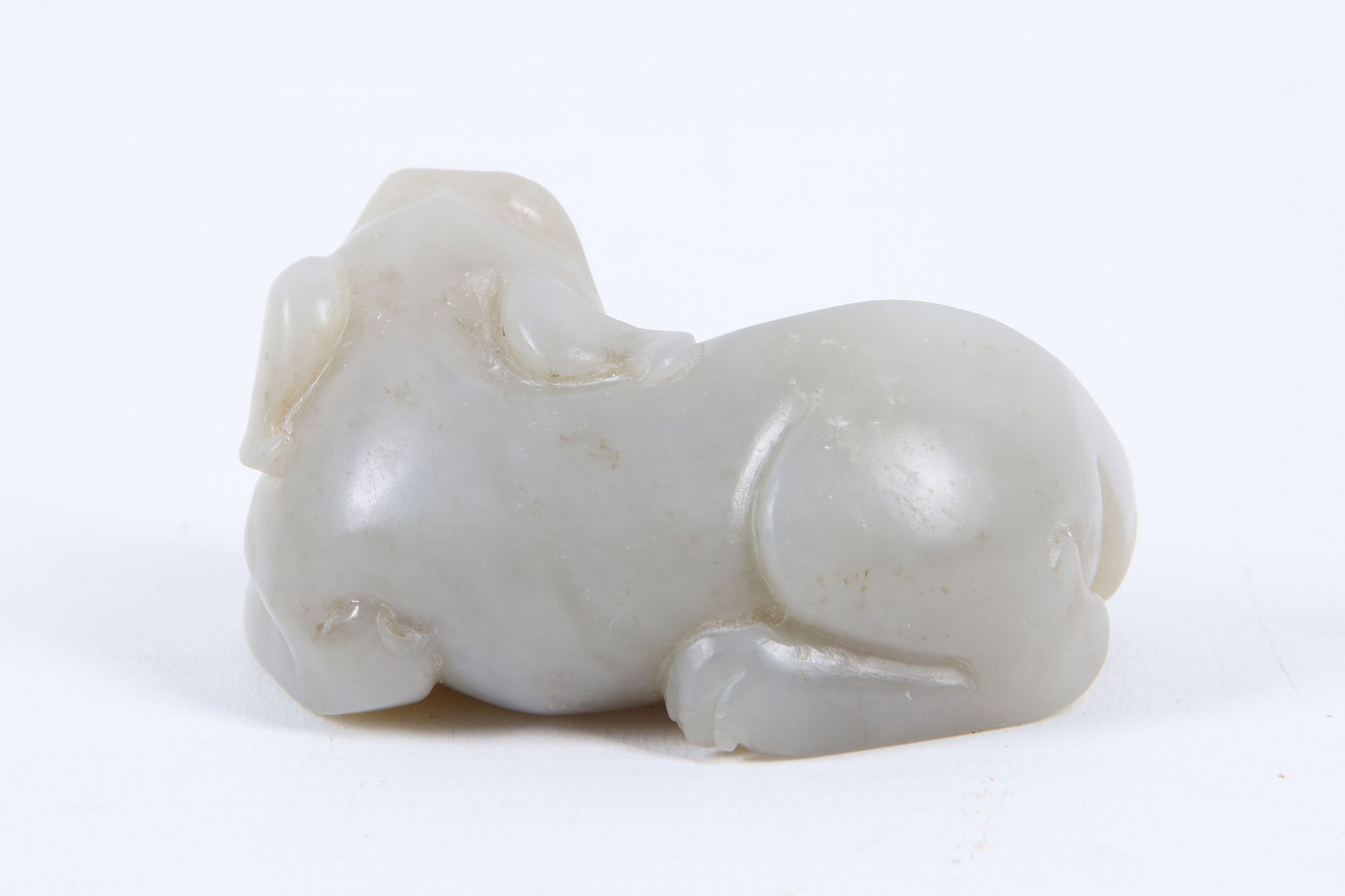 A Chinese mutton fat jade carving of a recumbent dog of Fo, 6.5cm. - Image 2 of 2