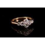 An 18ct yellow gold and diamond set six stone ring. Diamond: 1ct total.