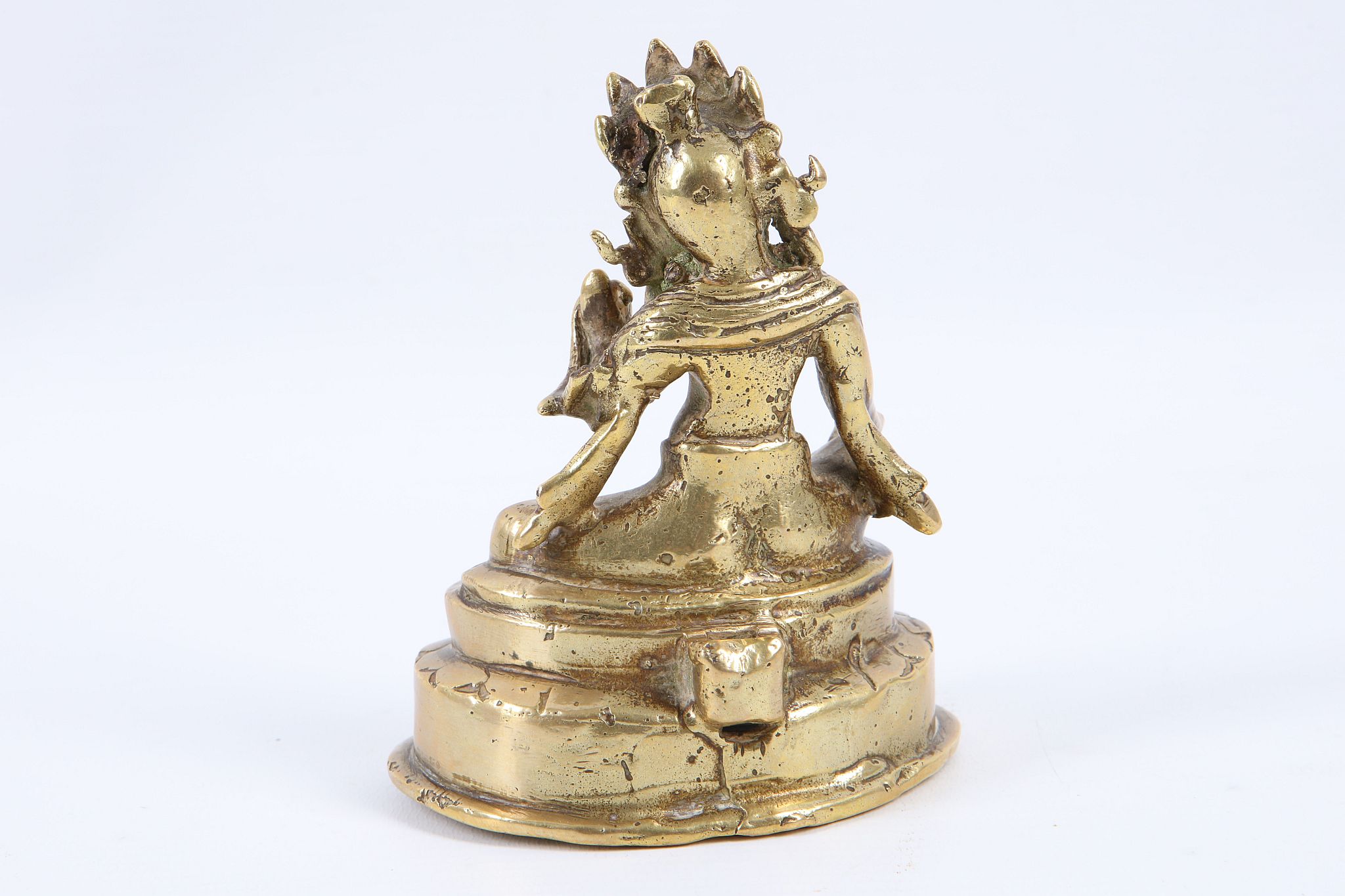 A small 19th Century Sino-Tibetan bronze statue of a seated Buddha, 10cm high. - Image 2 of 3