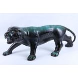 A large green / blue glazed pottery design of a tiger, 60cm long x 26cm high.