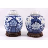 A pair of Chinese 19th Century blue and white ginger jars and covers, decorated all round with birds