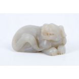 A Chinese mutton fat jade carving of a recumbent dog of Fo, 6.5cm.