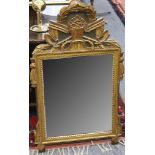 A French Empire style carved giltwood wall mirror, 94cm.