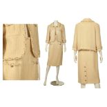 CHANEL CREAM BOUCLE SKIRT SUIT, dated 2007, the jacket with gilt chain and wool braided trim, two