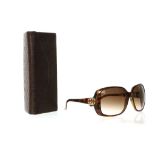 GUCCI SUNGLASSES, brown tortoiseshell effect frames with logo to side, model number GG 3166/S,