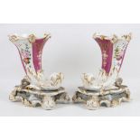 A pair of Continental porcelain cornucopia vases, late 19th Century, painted with sprays of