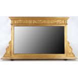 A small Adam style gilt finish oval mantle mirror, 56cm high x 1 metre wide.