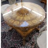 A 19th Century Italian, possibly Sorrento, centre table, the shaped circular top profusely inlaid