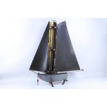 A mid 20th Century Bunting Company home metal heater in the shape of a boat, in complete order, 70cm
