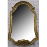 A substantial French 19th Century giltwood oval mirror, with arched frame, the base set with