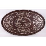 A Korean mother of pearl inlaid oval wooden tray, the decoration depicting flowers, butterflies