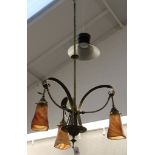 An Art Nouveau 3 branch brass ceiling light (possibly Benson), fitted with marbled shades by