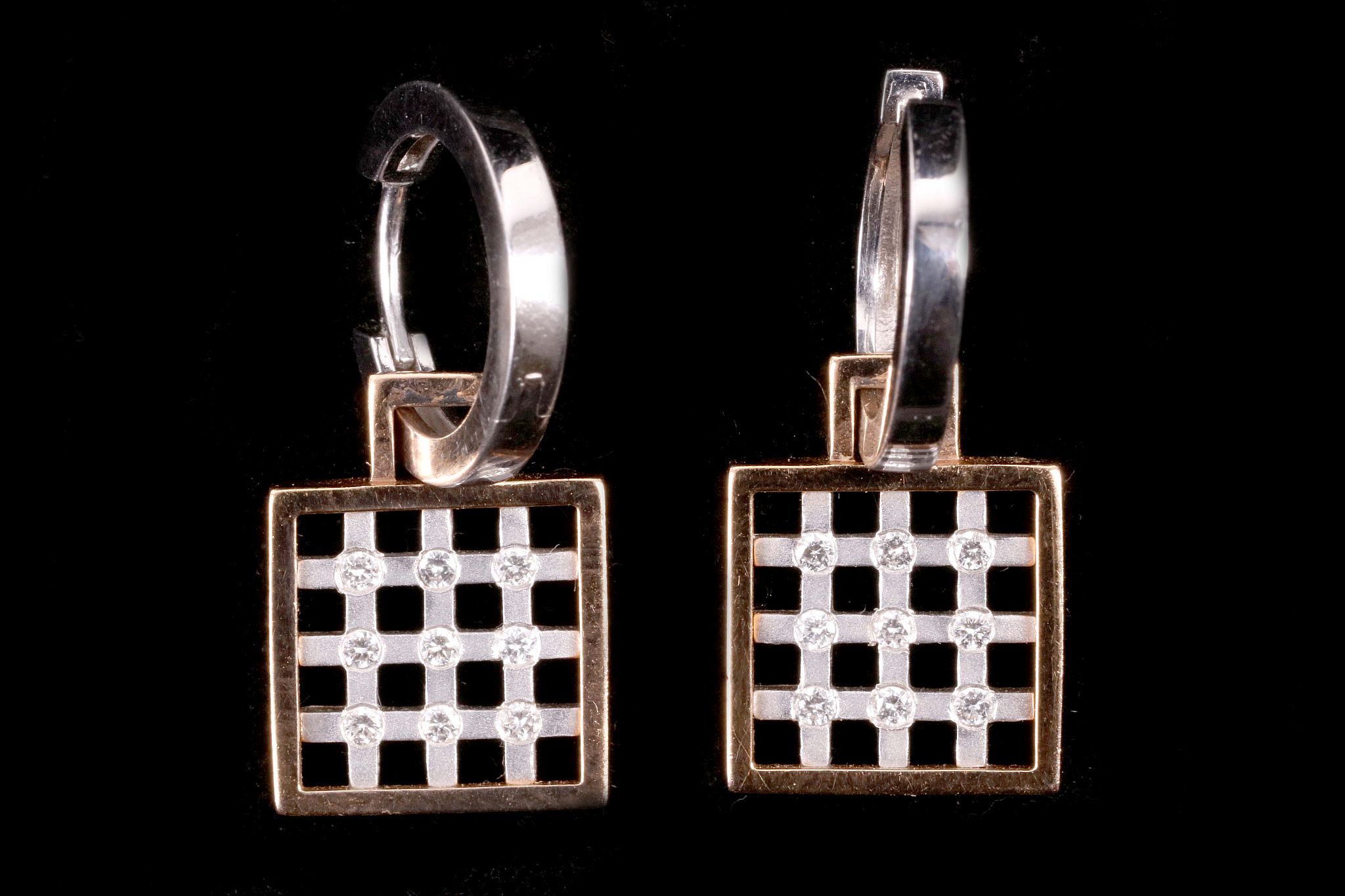 A pair of 14 carat white and rose gold chequerboard earrings, each set with nine small brilliant cut