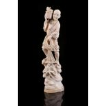 A 19th Century Japanese carved ivory figure of a fisherman with net and basket of fish, 26cm high.