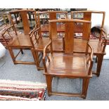 A set of four Chinese wood yoke back armchairs, 98cm high.