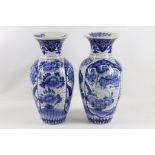 A pair of late 19th Century Japanese baluster vases decorated in blue (2).