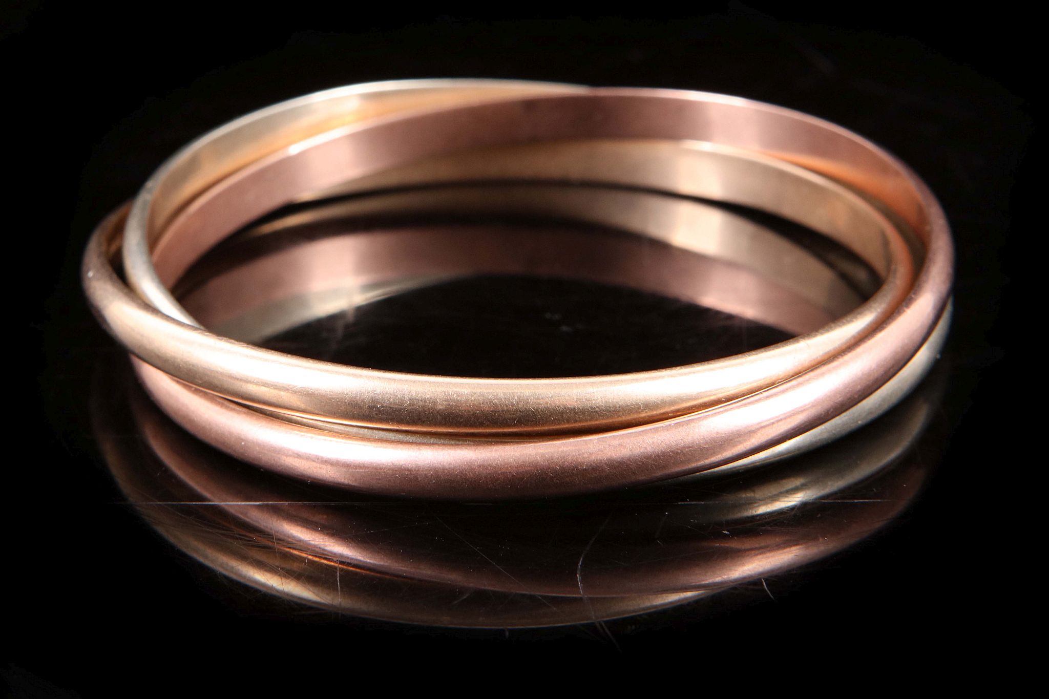 A group of nine carat tri coloured gold 'Russian' style bangles, approximate total weight 60 grams - Image 2 of 2