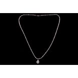 A white gold mounted pear cut diamond pendant, suspended from a 9ct white gold snake link chain with