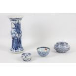 After Kang XI period, a 19th Century blue and white porcelain vase, tea bowl, a 19th Century Chinese