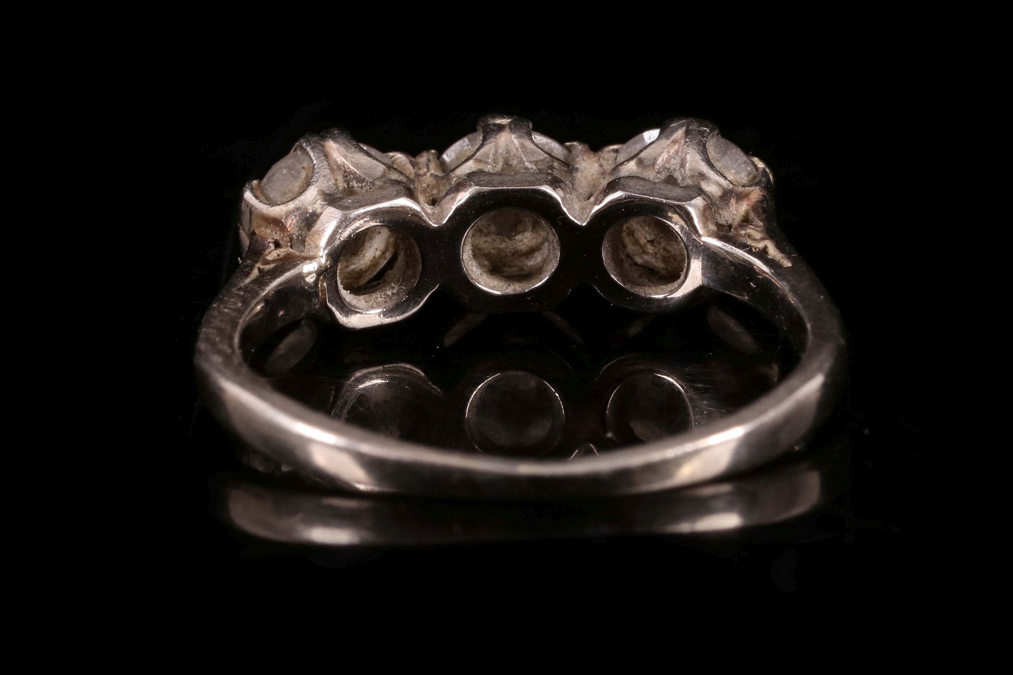 A diamond three stone ring c.1930, set with three uniform sized brilliant cut diamonds, claw set - Image 2 of 2