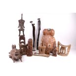 A collection of 10 African tribal items to include a helmet, pulley, 3 headrests etc (10).