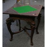 A well carved 20th Century Japanese card table, the top divided with 4 and carved with