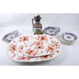 A large early 19th Century porcelain platter with gadrooned edge and decorated with iron red and