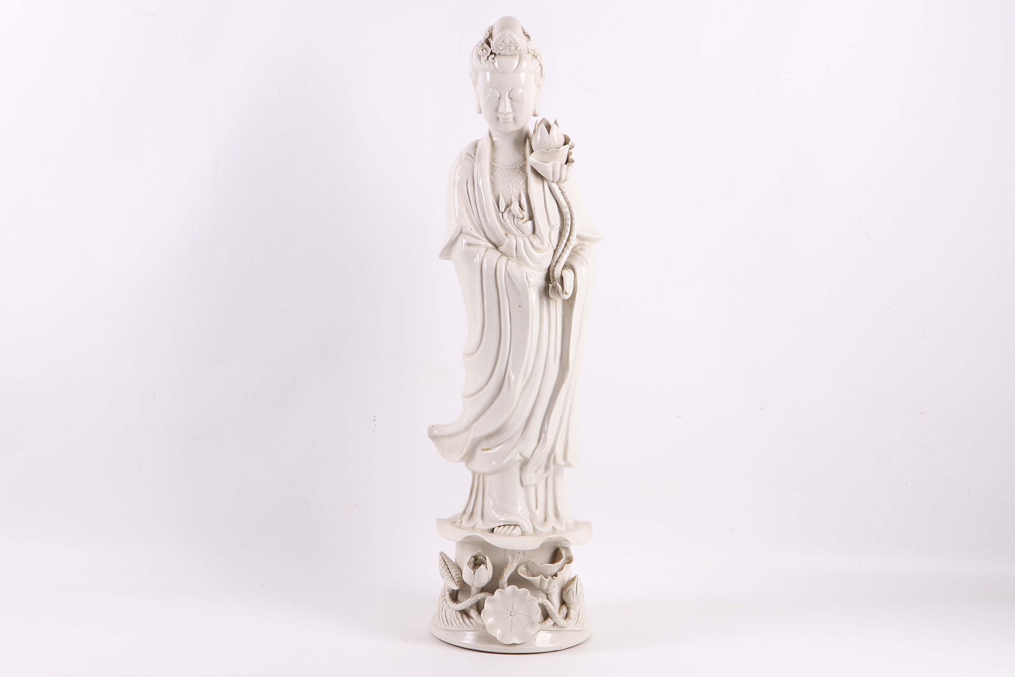 A 19th Century Chinese blanc de chine porcelain figure of Guanyin. 56cm tall. A/F: some chipping