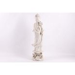 A 19th Century Chinese blanc de chine porcelain figure of Guanyin. 56cm tall. A/F: some chipping