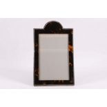 An Art Deco silver and tortoiseshell photograph frame, with arched top, Birmingham 1923, 24cm.