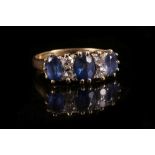 A late Victorian sapphire and diamond seven stone ring, mounted in 18ct yellow gold.