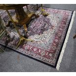 An Indian silk style carpet, 275 x 185cm.