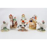 A collection of Staffordshire pottery figural spill vases, 19th Century, comprising one modelled