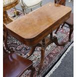 An early 19th Century mahogany card table, with 'D' shape top on quadripartite sabre leg support,