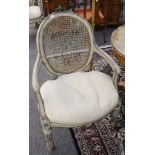 A set of 4 decorative antique French open armchairs in Louis XVI style, with oval cane backs and