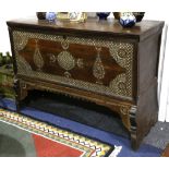 A 19th Century Syrian mahogany and mother of pearl inlaid chest with hinged top and supported on