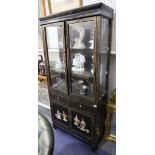 An Oriental black lacquered display cabinet, with twin glazed doors, 81cm wide, together with a