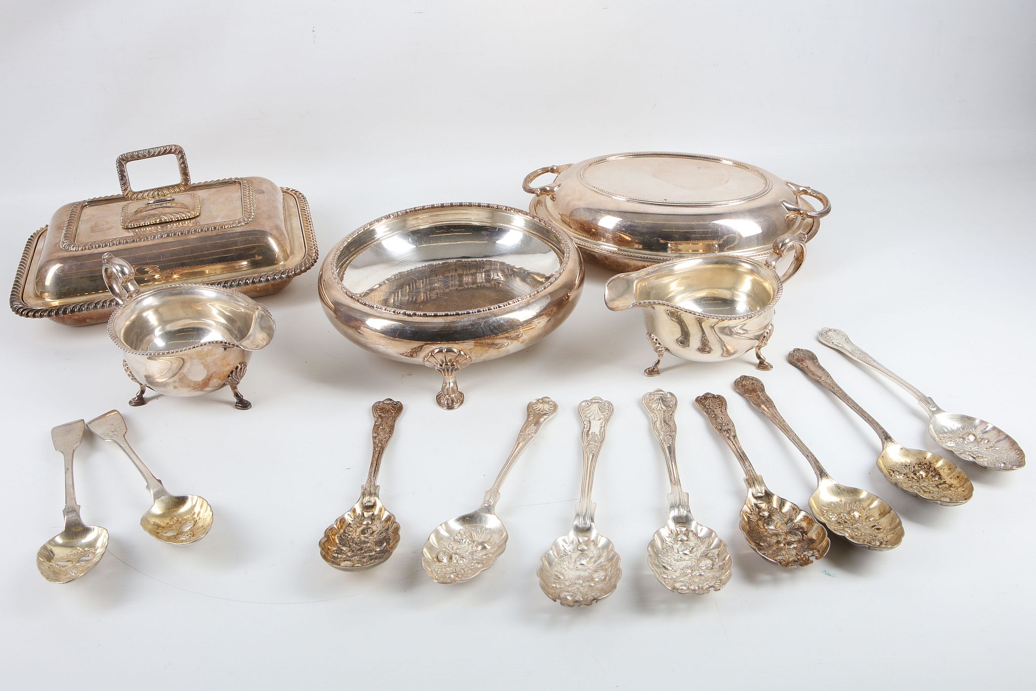 Two hallmarked silver Georgian berry spoons, London 1829, sold with a quantity of silver plated