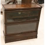 An early 20th Century 'The Globe - Werwicke', two section oak cased and glazed bookcase, by