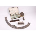 A cased set of 6 hallmarked silver teaspoons with sugar tongs, sold with a hallmarked silver purse