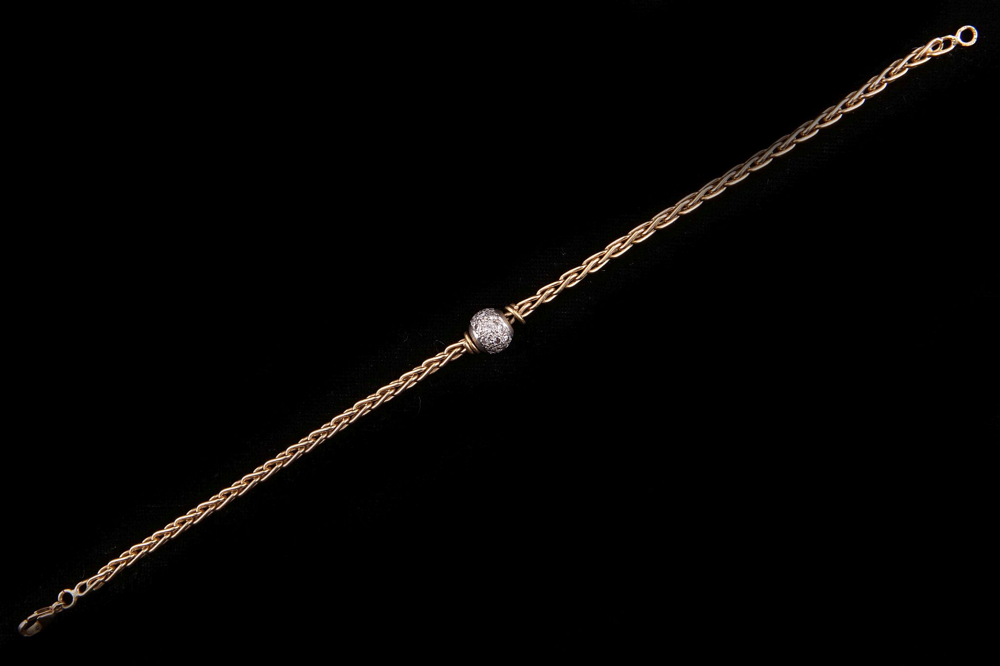 An 18 carat gold and diamond ball bracelet, the foxtail link chain with a pave set diamond ball to - Image 2 of 2
