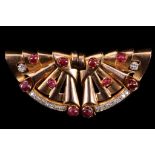 A c.1940's French 18ct rose gold, cabochon ruby and diamond set double clip fan brooch.